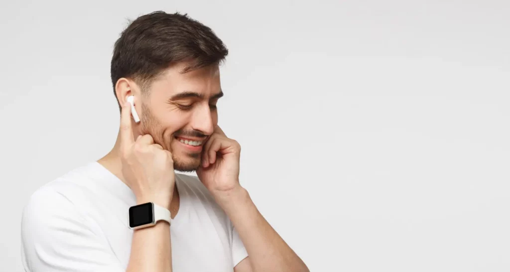 Man with wireless earphones in ears